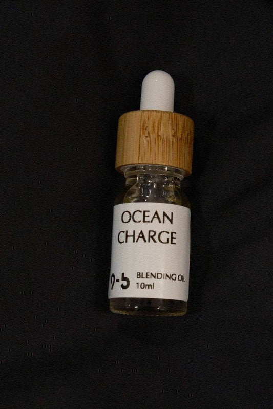 9to5 Studios Ocean Charge Blending Oil 10ml glass dropper bottle centered on black background