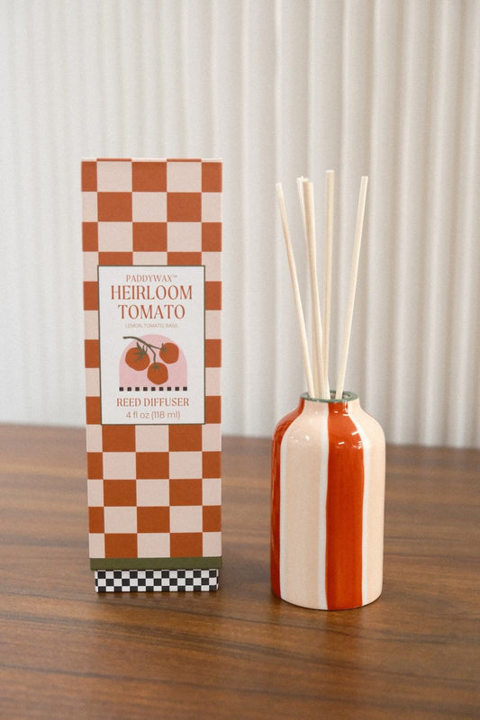 Paddywax Heirloom Tomato Reed Diffuser in orange cream striped ceramic with reeds and checkered box