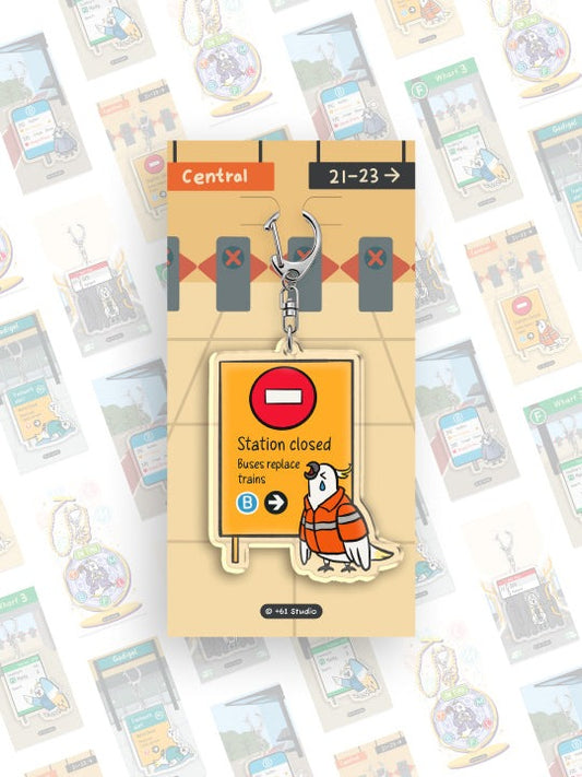 9to5 Studios train station platform backing card keychain with silver clasp