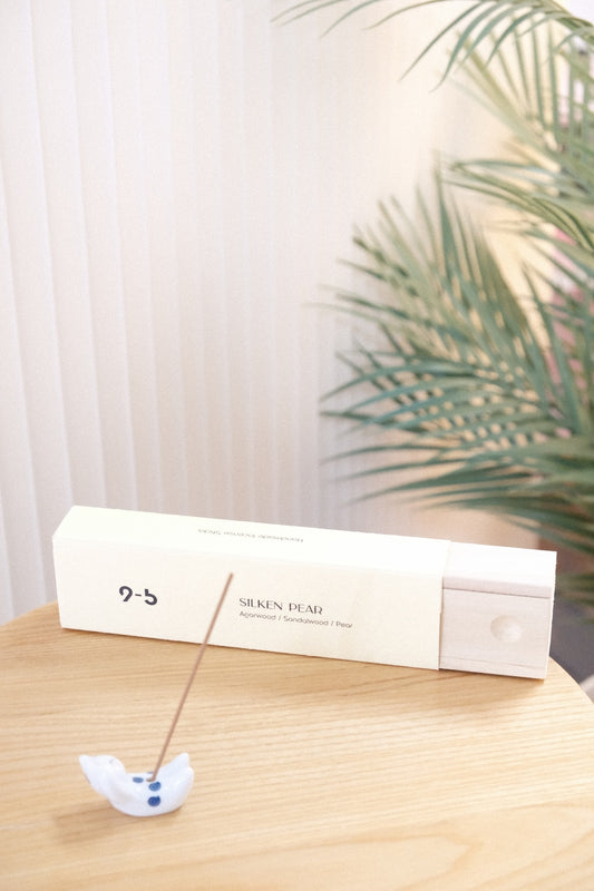 Silken Pear incense box with lit stick in ceramic holder