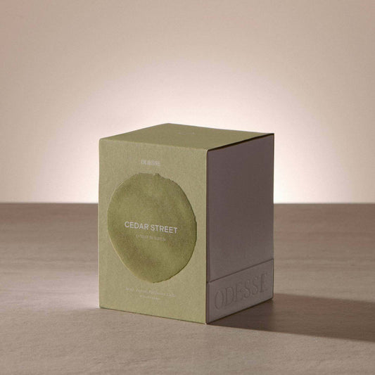 Odesse Cedar Street Extrait De Parfum bottle with apple, lemon, and cedar notes design