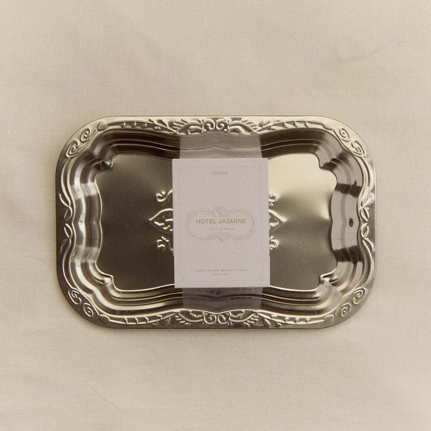 Odesse Hotel Jasmine Extrait De Parfum bottle with jasmine, saffron, cedar scent notes and elegant design
