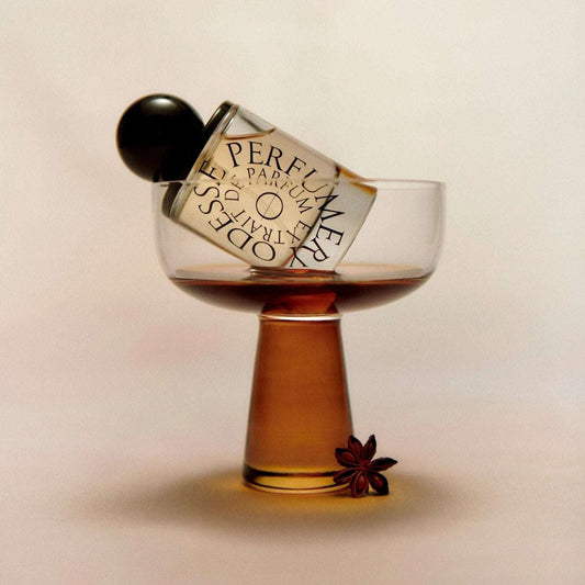 Odesse perfume bottle styled in coupe glass with star anise at 9to5 Studios