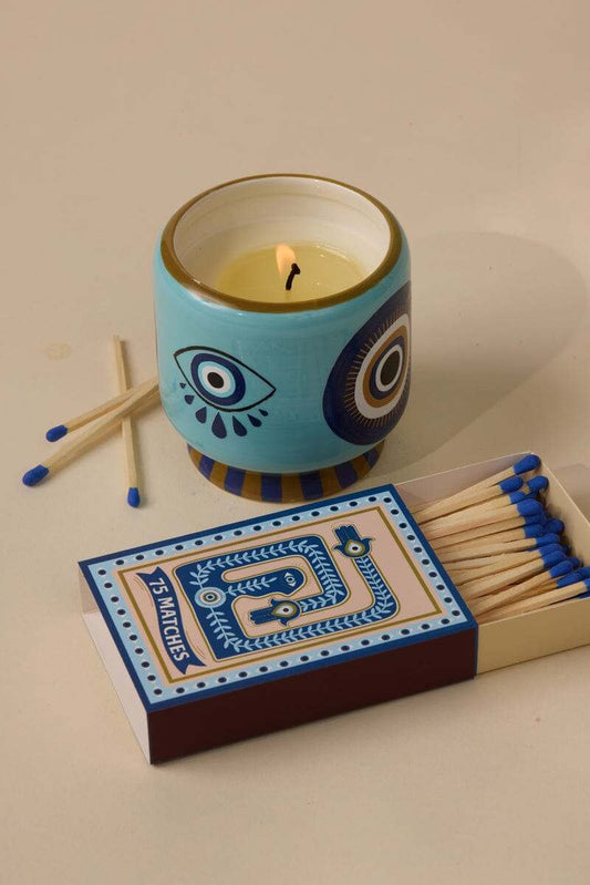 Paddywax A Dopo Eye candle with smoky incense, frankincense, and citrus scent in decorative eye design jar