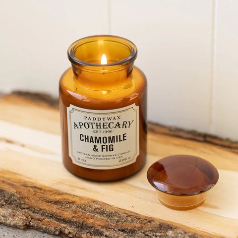 Paddywax Apothecary Chamomile & Fig candle in amber jar with fruity and herbal scent notes