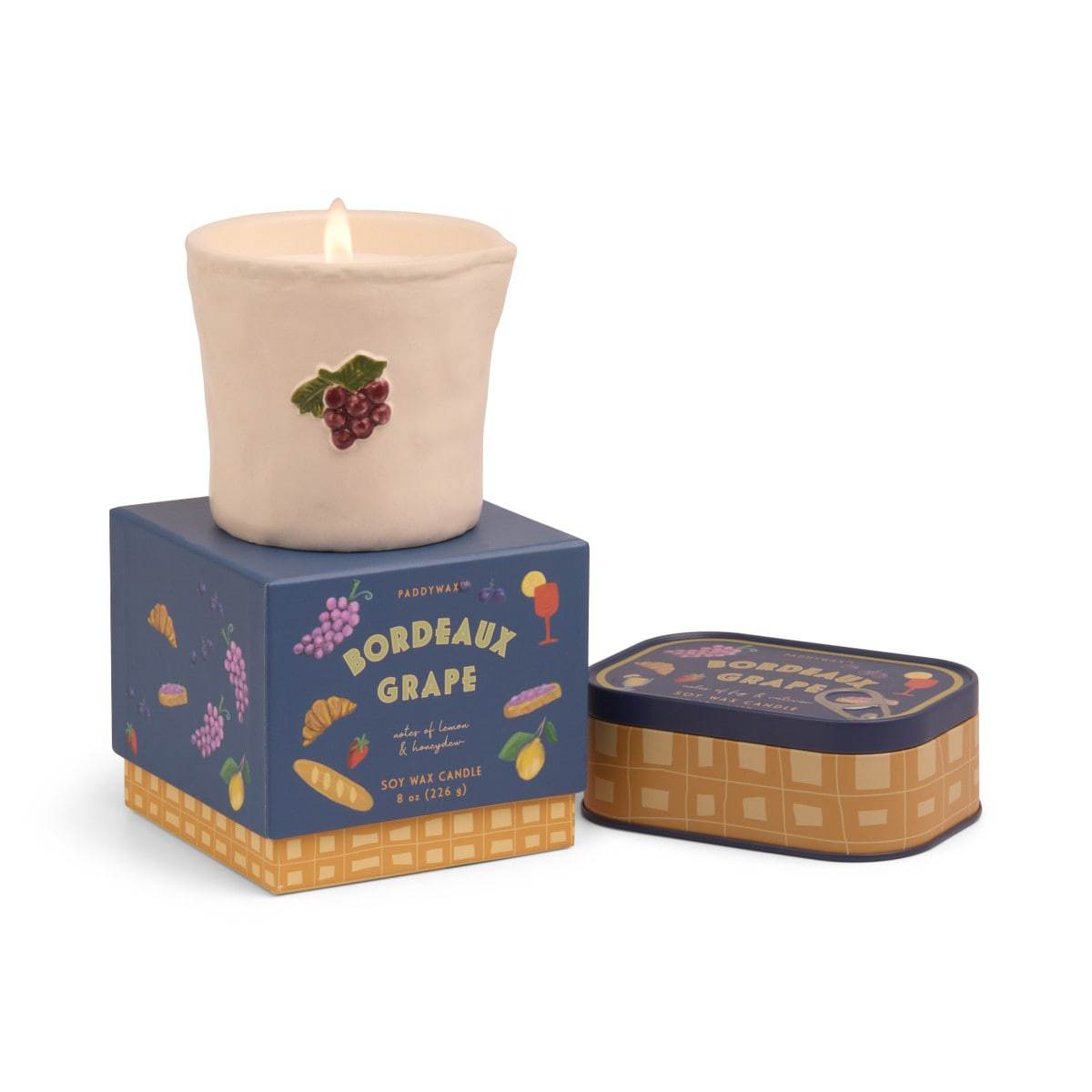 Paddywax Bistro Bordeaux Grape candle in illustrated grape tin with fruity and floral scent notes