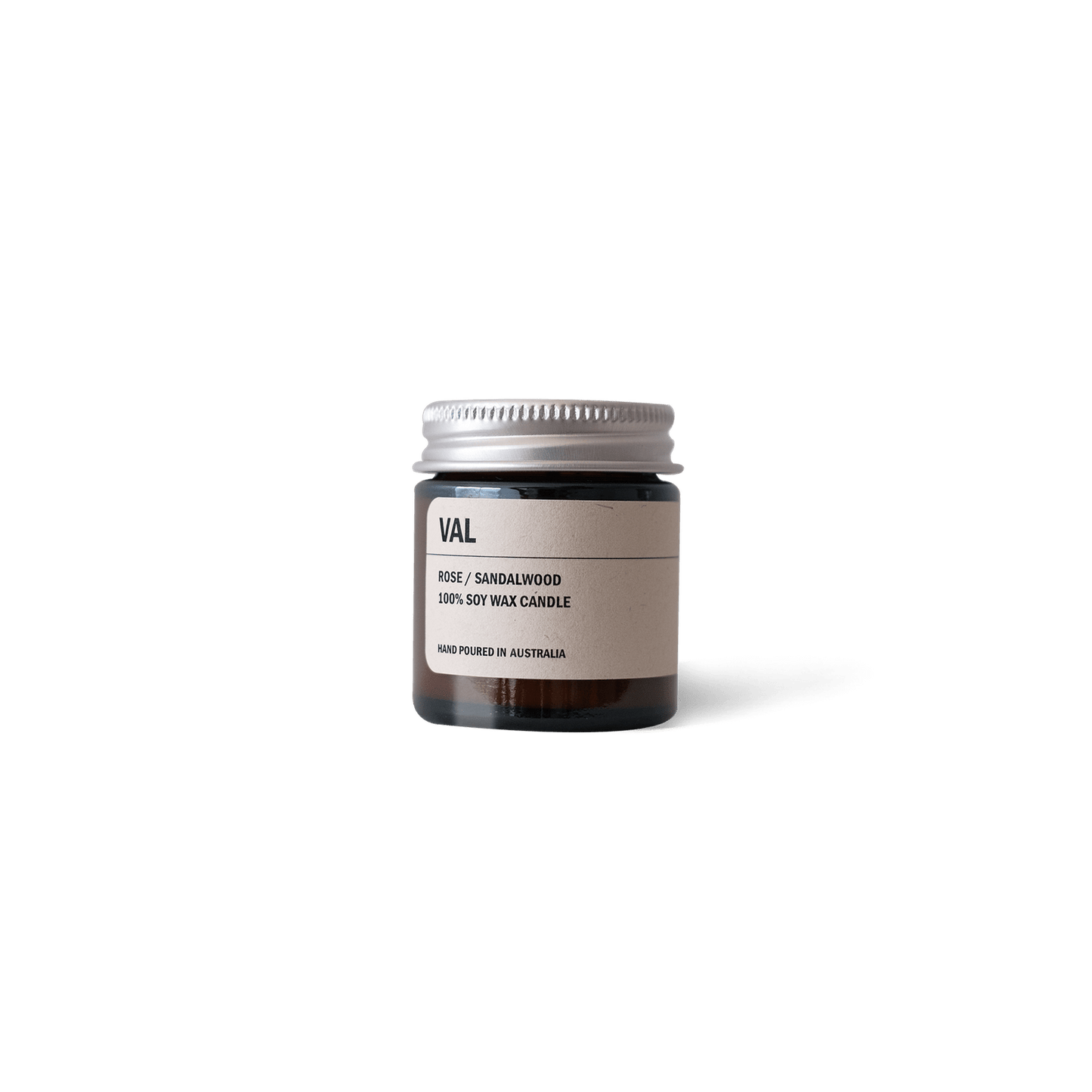 Posie Candle VAL with Rose, Sandalwood, and Yuzu scent in amber glass jar