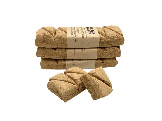 Tribe Earth PRESENCE handmade incense plank with Vetiver Grass and Sandalwood burning in a dish