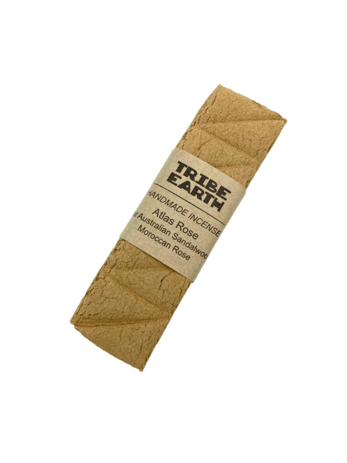 Tribe Earth ROSES Handmade Sandalwood and Moroccan Roses incense plank burning in a heat resistant dish