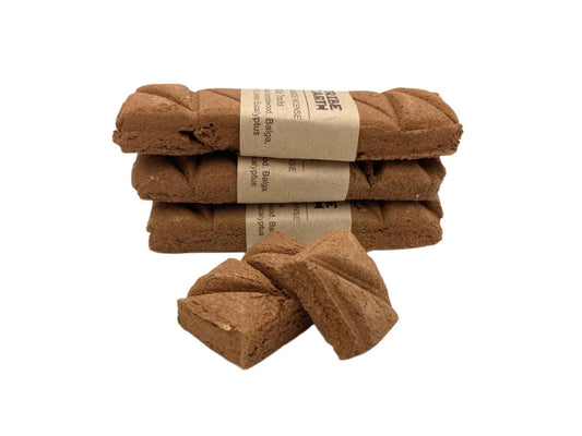 Tribe Earth WILD TRACKS Incense Plank with Western Australian Sandalwood and natural blend burning on a wooden surface