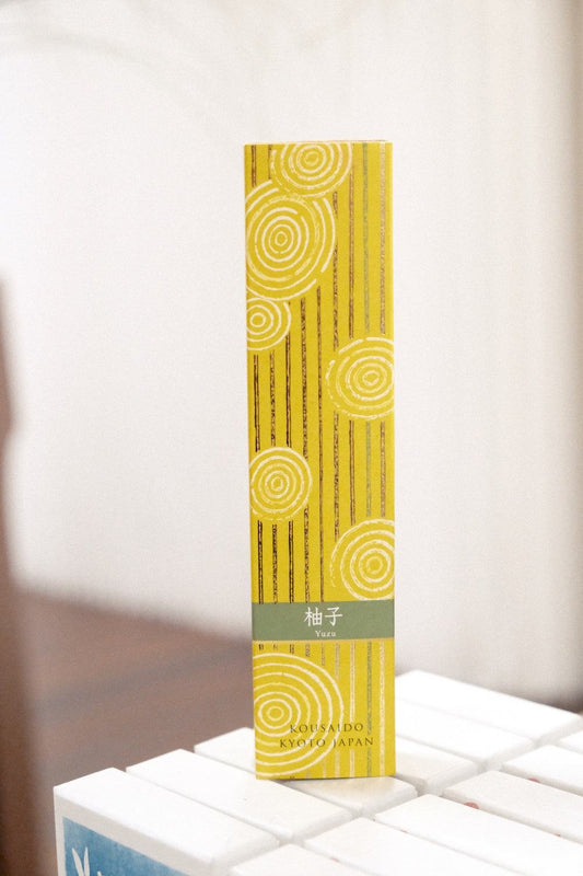 Kousaido Hyakurakko Yuzu Incense sticks showcasing fresh citrusy yuzu scent in a traditional Japanese setting