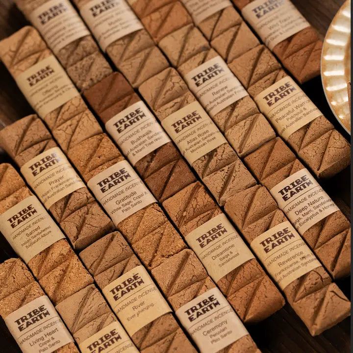 TRIBE EARTH handmade incense planks in earthy brown clay texture with Prayer and Gratitude scents on dark wood