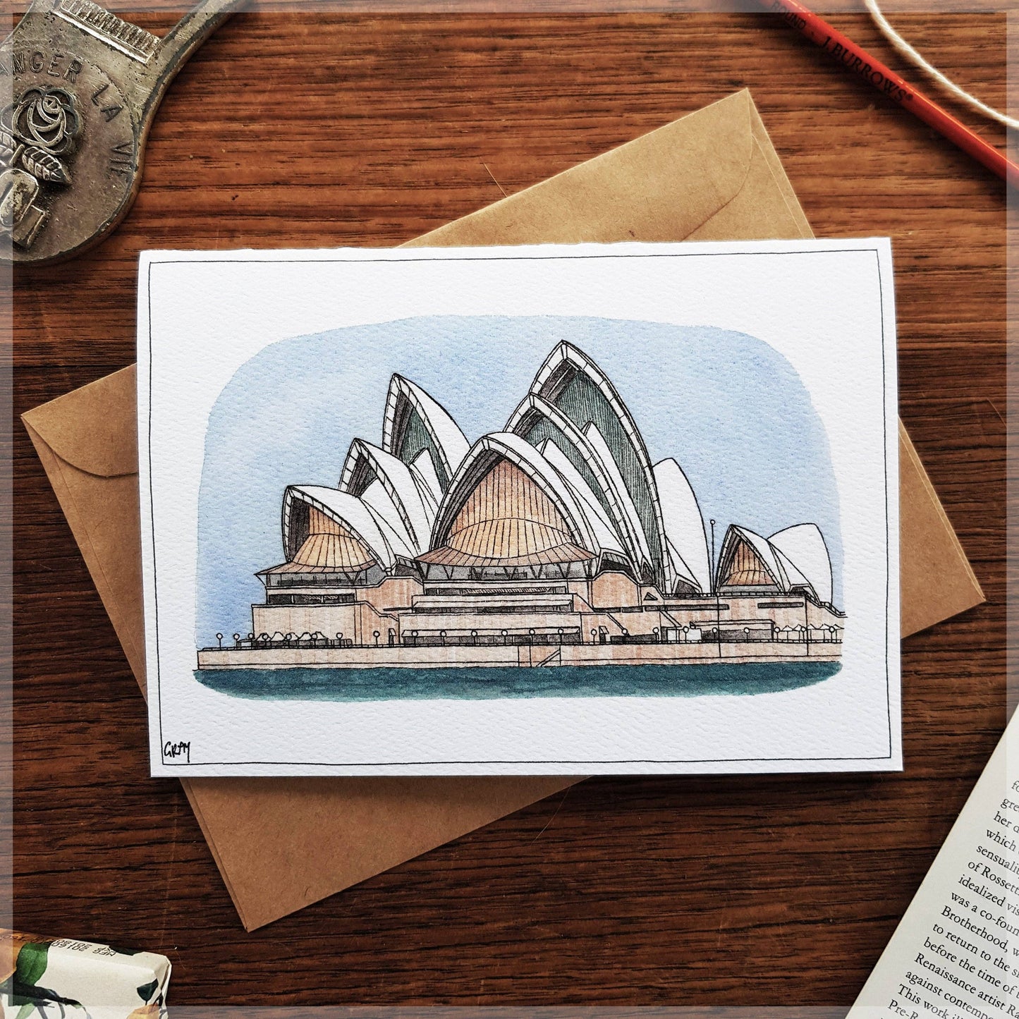 Illustration of Sydney Opera House on A6 greeting card with brown envelope and protective sleeve