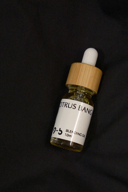 Close-up 9to5 Studios Citrus BANG Blending Oil 10ml glass dropper bottle minimalist flat lay