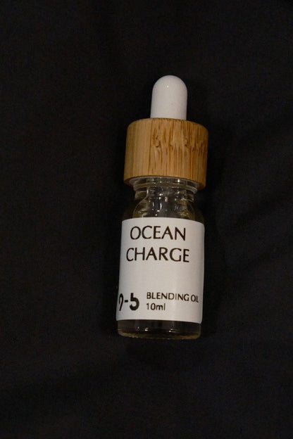 9to5 Studios Ocean Charge Blending Oil 10ml glass dropper bottle centered on black background