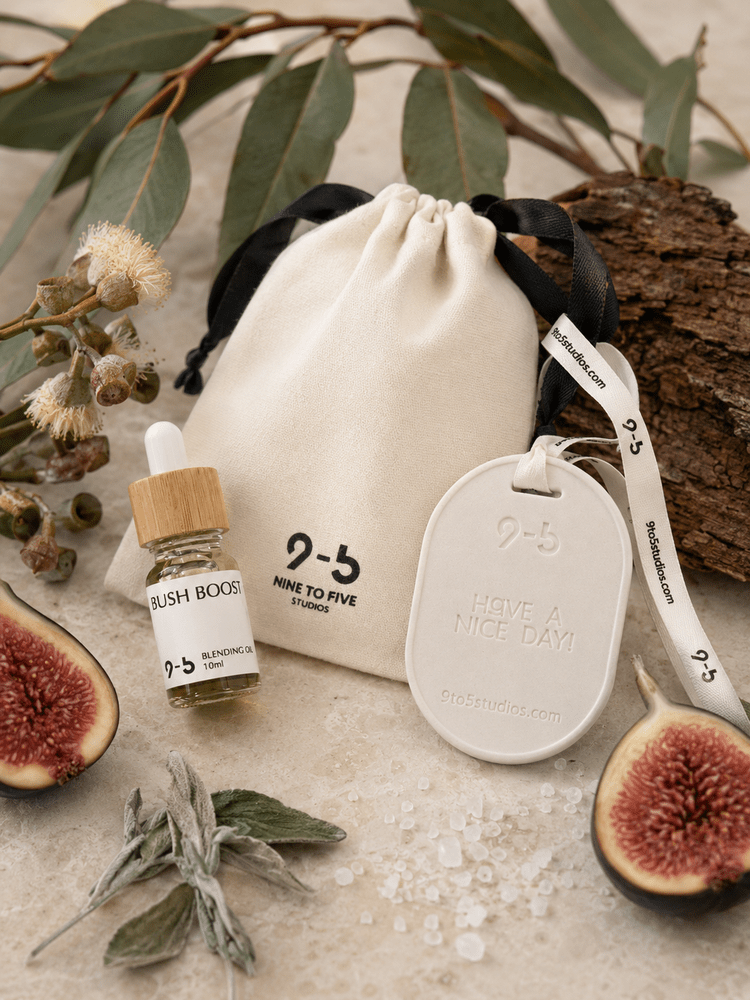 9to5 Studios Bush Boost aromatherapy set with eucalyptus fig props showing natural scent ingredients