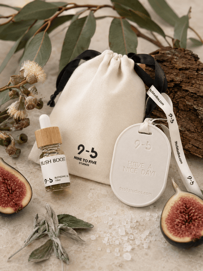 9to5 Studios Bush Boost aromatherapy set with eucalyptus fig props showing natural scent ingredients