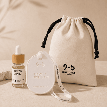 9to5 Studios Ocean Charge ceramic stone diffuser trio with embossed text, blending oil bottle, and branded cotton pouch