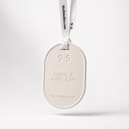 White oval tag with 'Have a nice day!' text on a white background