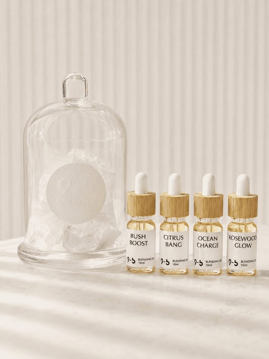 9to5 Studios crystal diffuser with natural faceted stone and four amber oil bottles