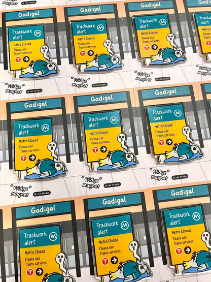 +61 Studio bulk display of identical Trackwork alert fridge magnets on cards