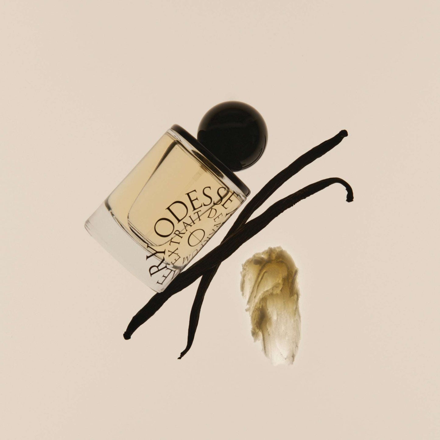 Odesse Crème Santal bottle with whole vanilla pods and bean paste showing scent notes at 9to5 Studios