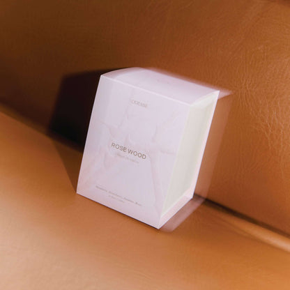 White Odesse Rose Wood box showing scent notes on leather surface by 9to5 Studios