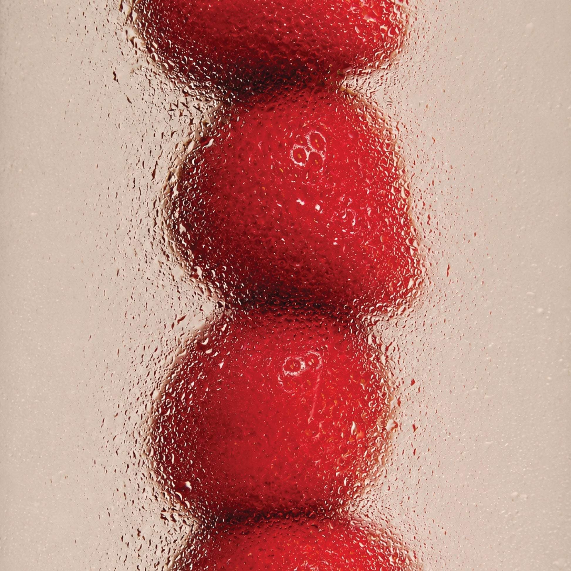 Fresh red strawberries behind frosted glass for Odesse Rose Wood by 9to5 Studios