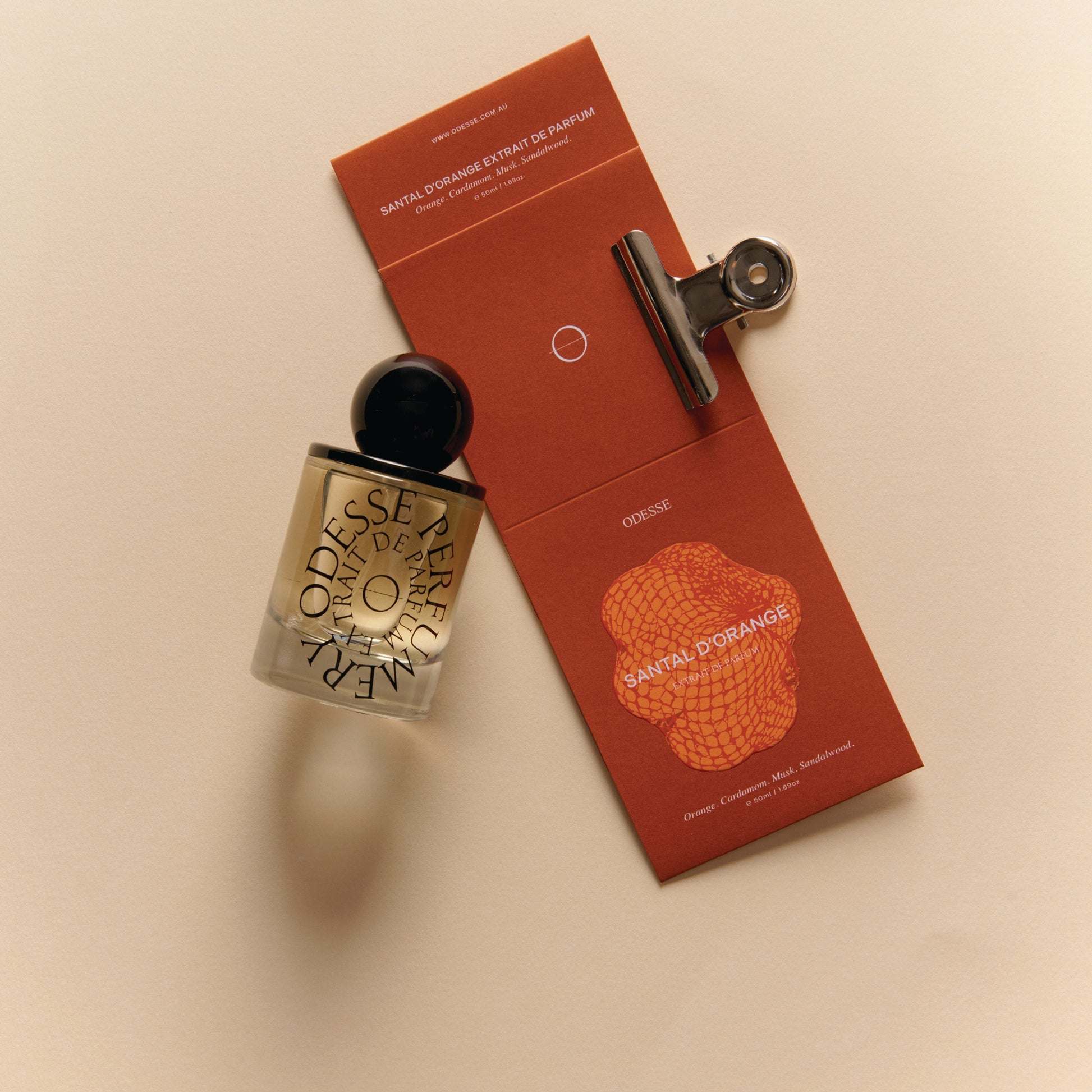 Odesse Santal D'Orange bottle with scent notes card at 9to5 Studios