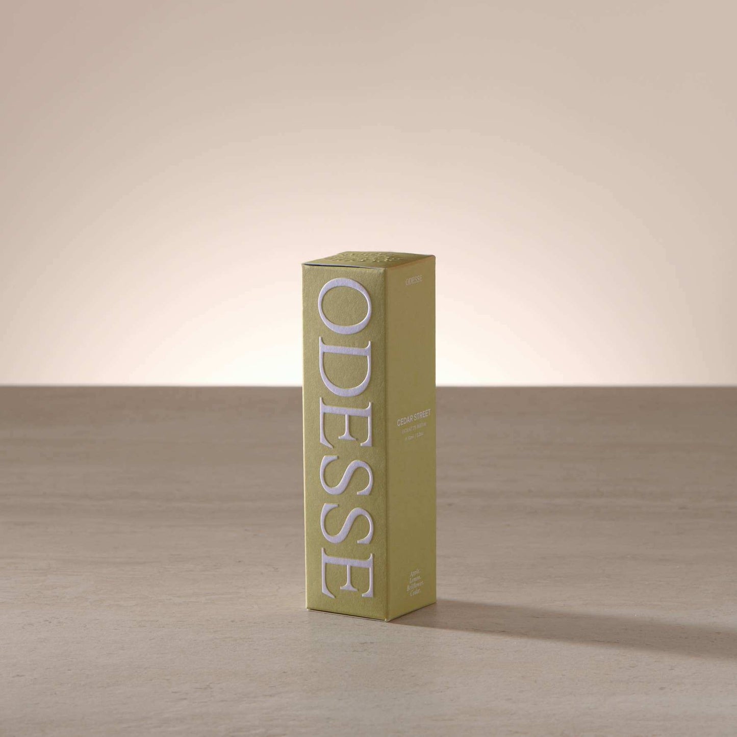 Odesse Cedar Street Extrait De Parfum olive green embossed packaging box by 9to5 Studios