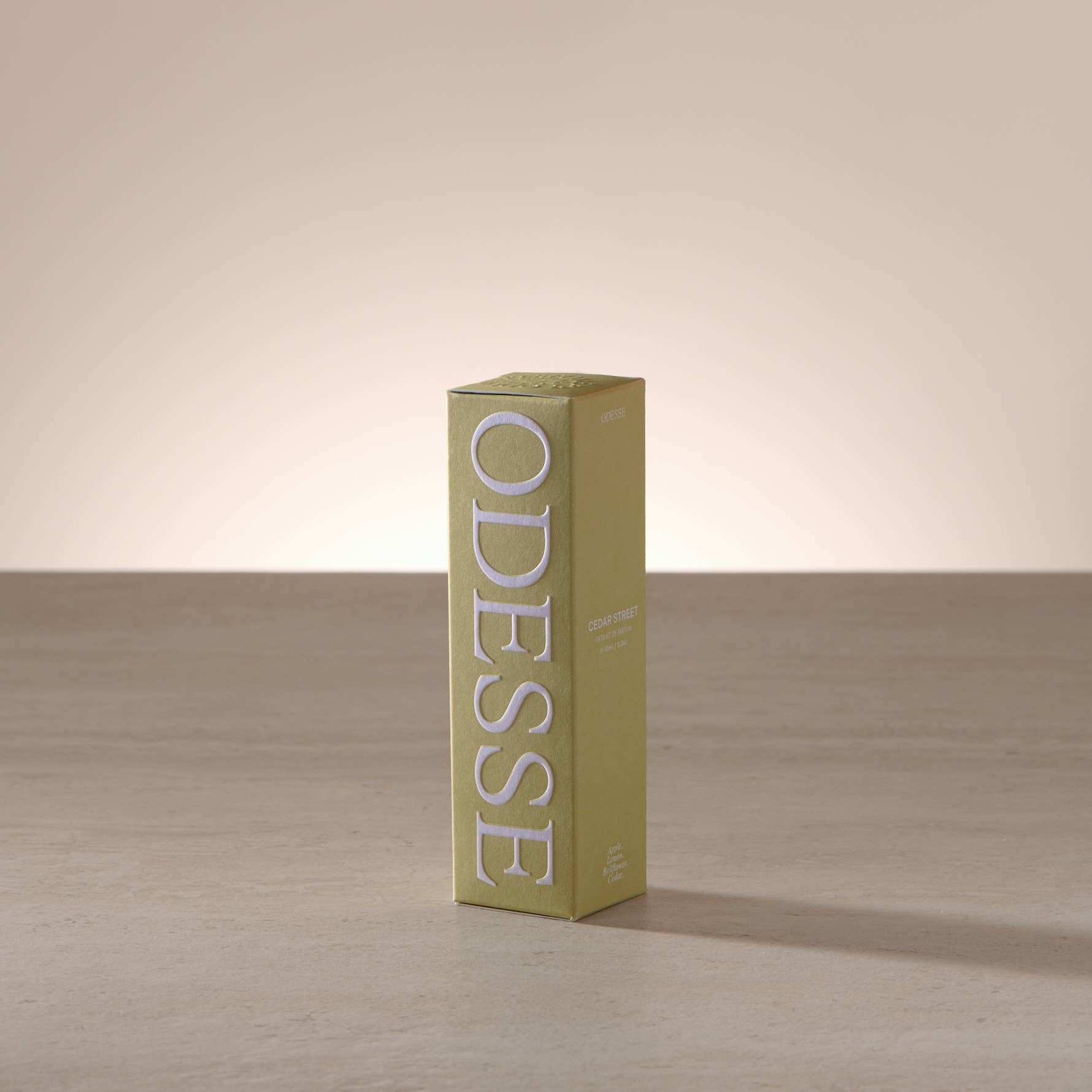 Odesse Cedar Street Extrait De Parfum olive green embossed packaging box by 9to5 Studios