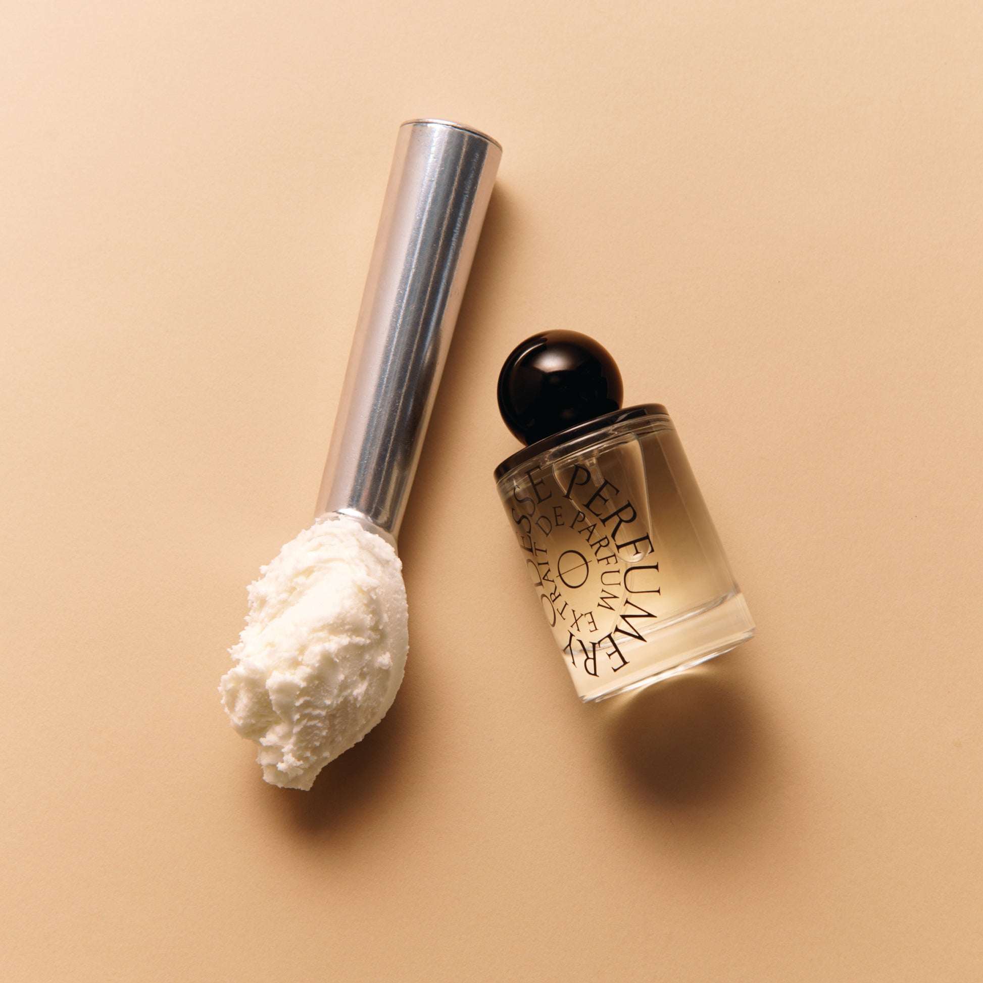 Vanilla ice cream scoop beside Odesse perfume bottle at 9to5 Studios