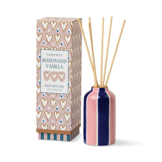 Paddywax Rosewood Vanilla reed diffuser with pink navy stripes and natural reeds