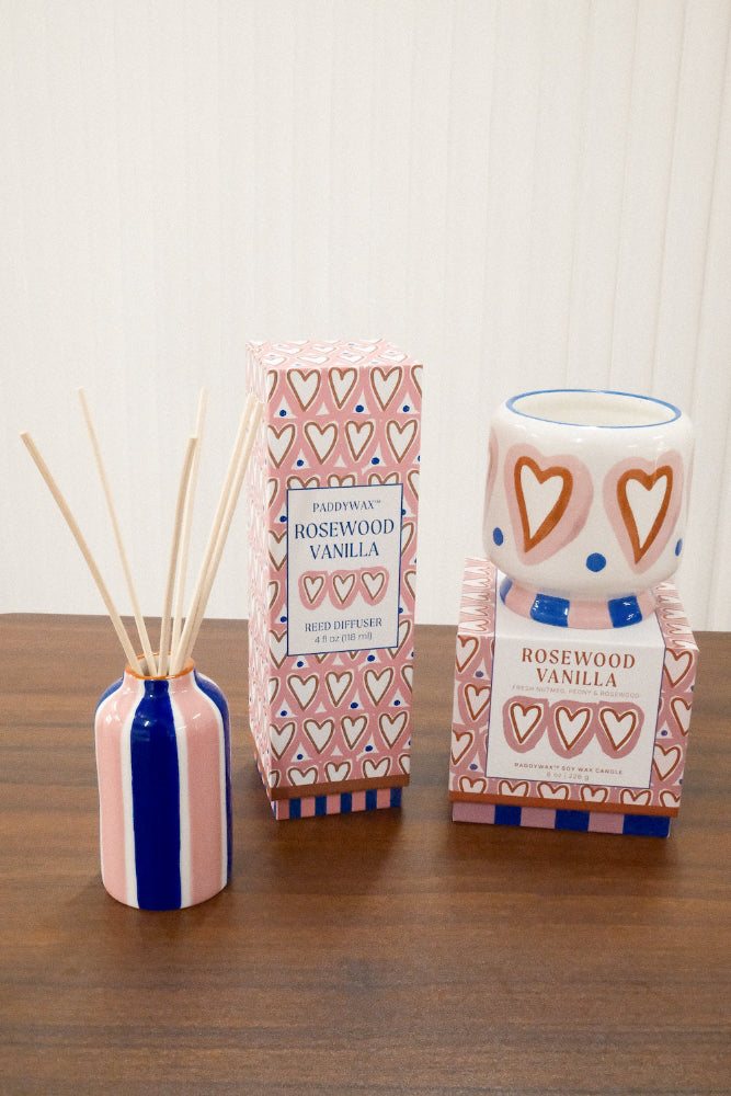 Paddywax Rosewood Vanilla diffuser and matching heart candle set on wood surface