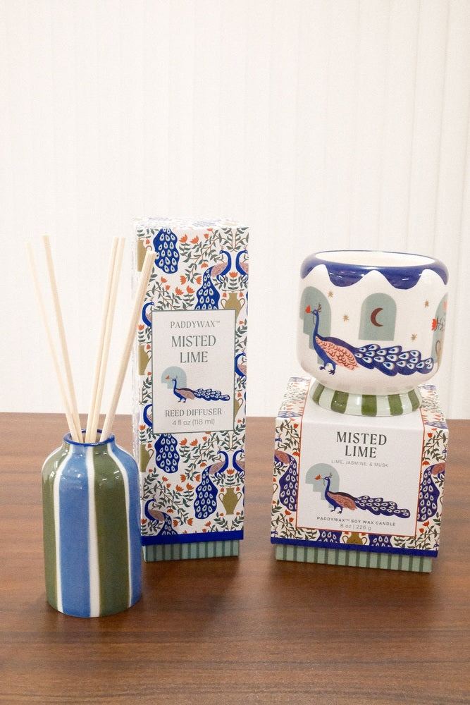 Paddywax Misted Lime home fragrance collection featuring reed diffuser, candle, and peacock patterned packaging