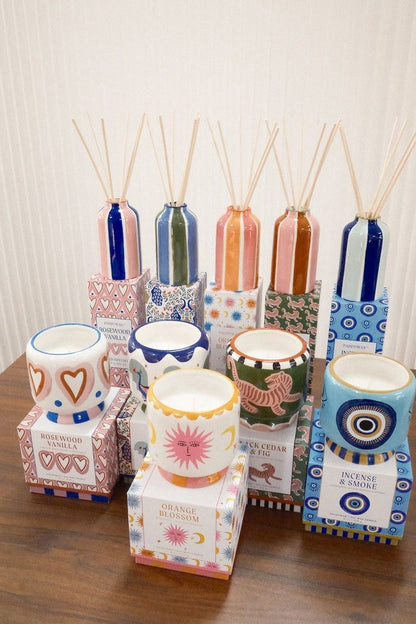 Full collection of Paddywax reed diffusers and candles featuring varied ceramic patterns and motifs