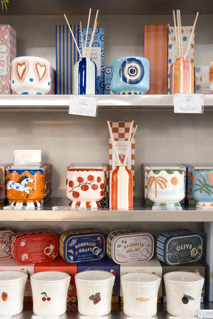 Paddywax A Dopo Tomato diffuser in blue white striped ceramic on retail shelf display