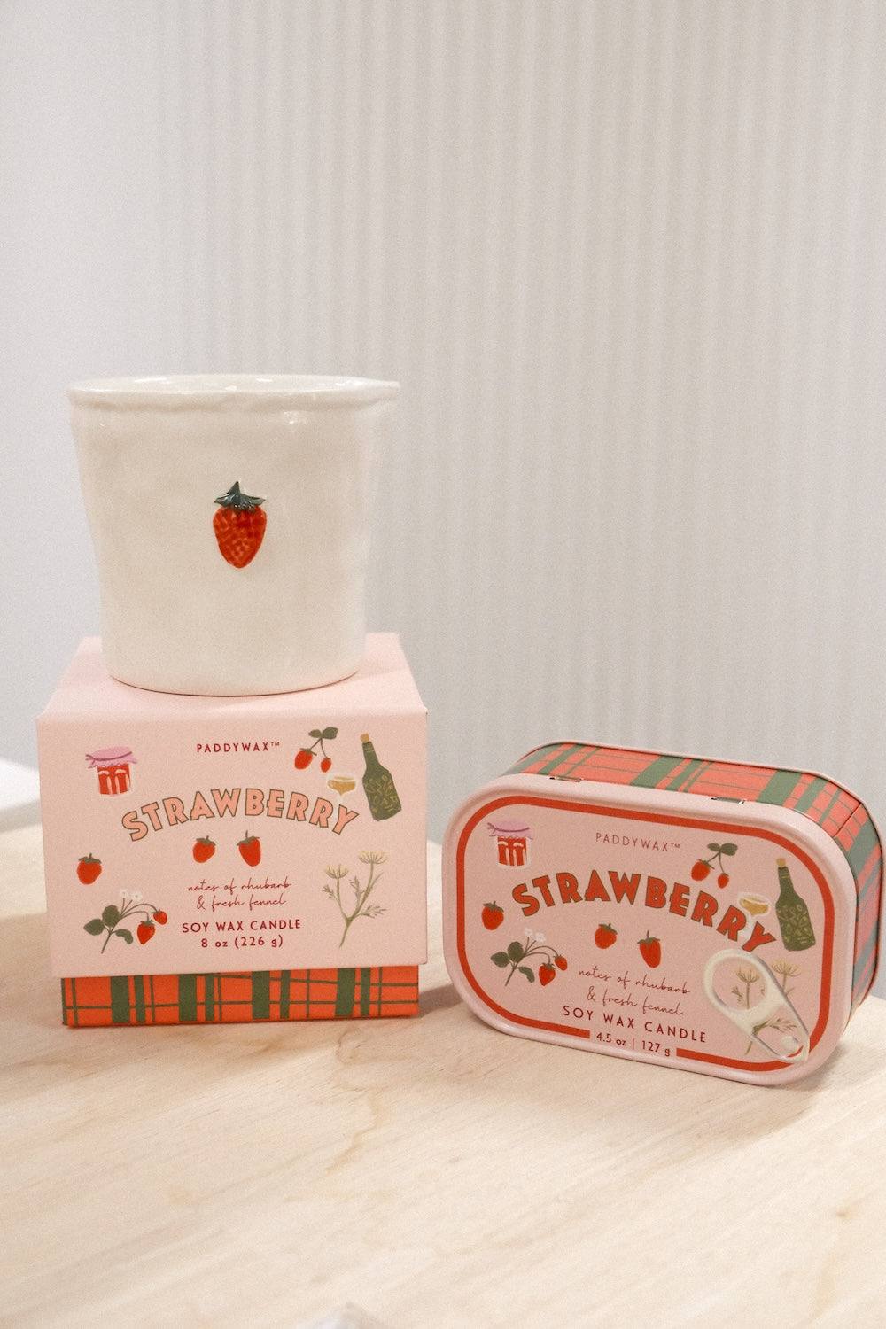 Paddywax Strawberry soy wax candle set with 8oz ceramic jar and 4.5oz plaid tin on wood