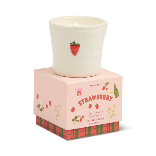 Paddywax Strawberry soy wax candle in white textured ceramic vessel with raised strawberry detail
