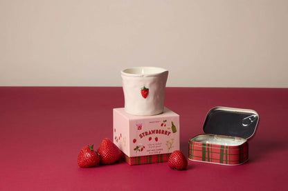 Paddywax Bistro Strawberry ceramic candle with red strawberry appliqué on pink plaid packaging
