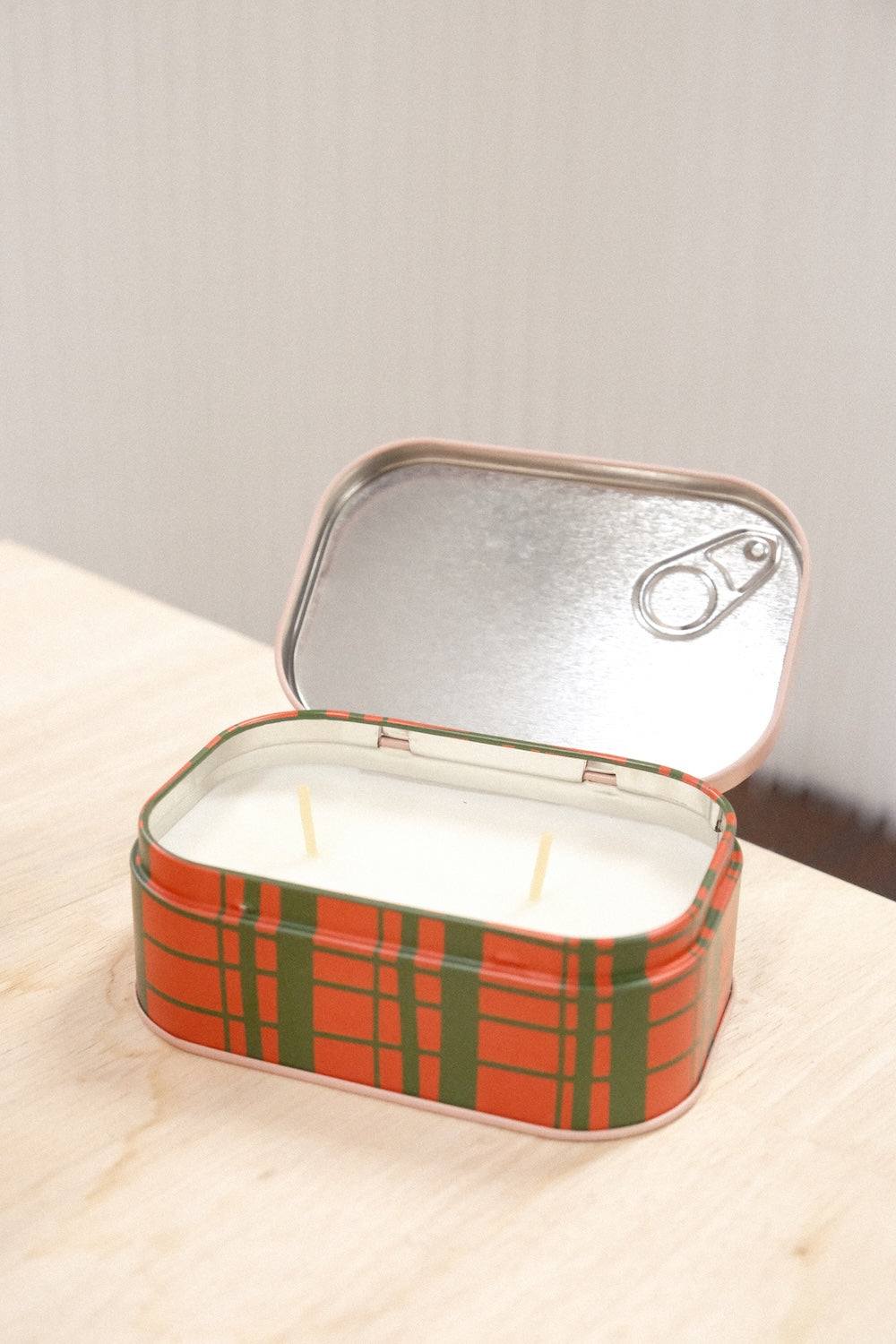 Open Paddywax Bistro Strawberry tin candle with orange green plaid exterior and dual cotton wicks