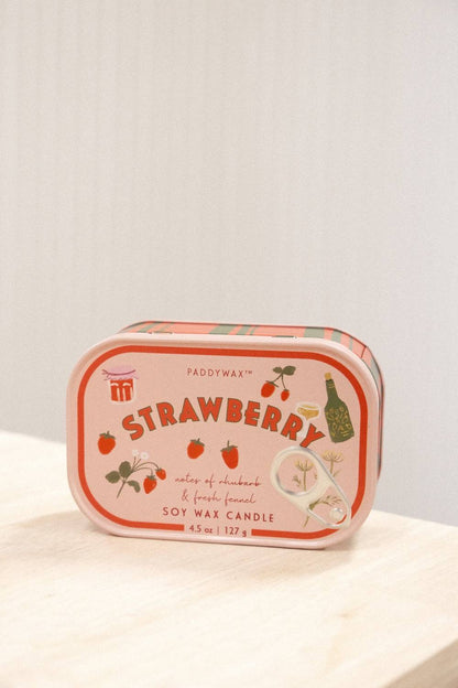 Front view Paddywax Strawberry soy wax candle featuring hand-drawn fruit illustrations on peach label