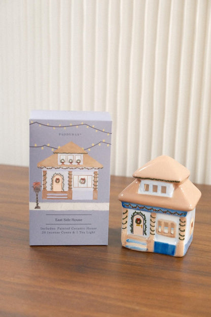 Paddywax beige and blue ceramic house incense burner showing front-right angle and retail box detail