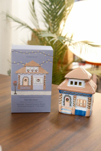 Paddywax East Side House ceramic incense holder with hand-painted green garland and lavender packaging on wood