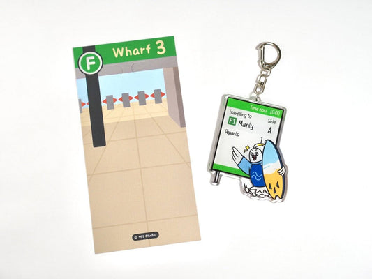 Happy cockatoo with surfboard sprinting to catch +61 Studio Ferry keychain to Manly on premium acrylic