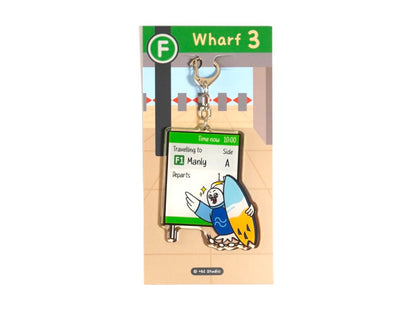 Happy cockatoo keychain holding surfboard running to catch Manly ferry by +61 Studio Ferry