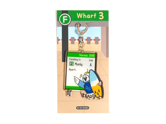 Happy cockatoo keychain holding surfboard running to catch Manly ferry by +61 Studio Ferry