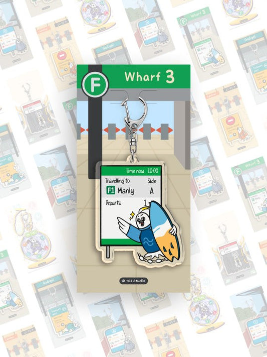 +61 Studio Ferry Travelling to Manly Keychain by 9to5 Studios, white cockatoo with blue surfboard on optical acrylic