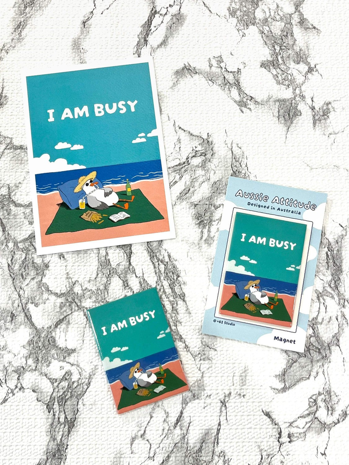+61 Studio I AM BUSY seagull fridge magnet by 9to5 Studios, Aussie Attitude Series tinplate with straw hat and sunglasses
