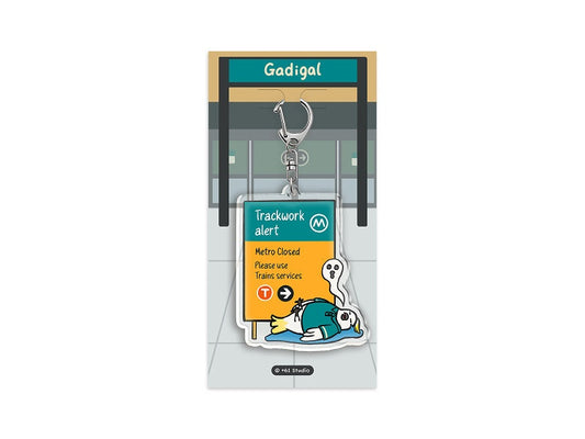 9to5 Studios +61 Studio Gadigal station keychain on backing card clear optical acrylic seal illustration